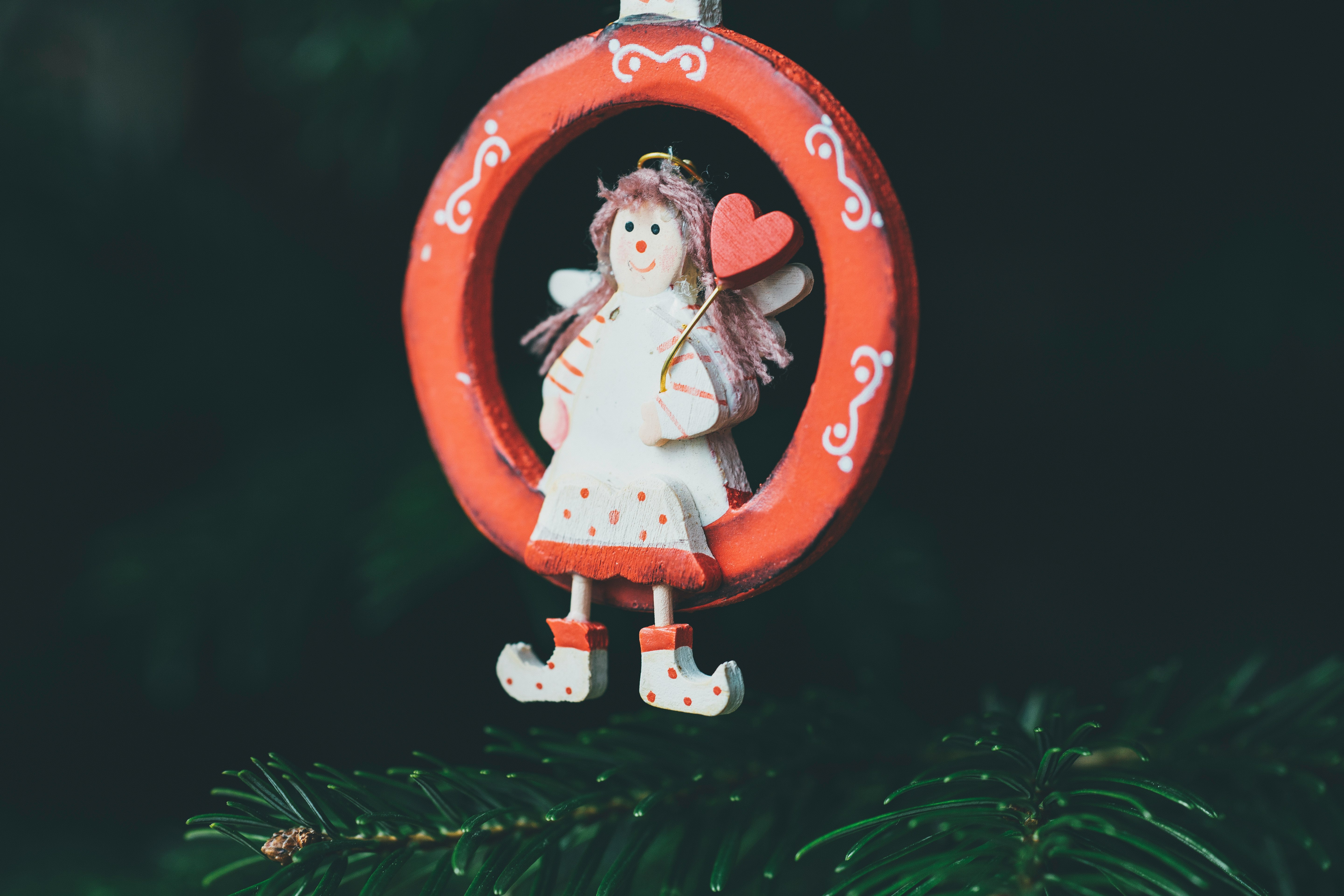 girl sitting on ring hanging decor